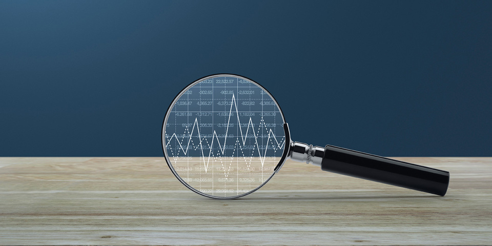 Magnifying glass enlarging stock chart