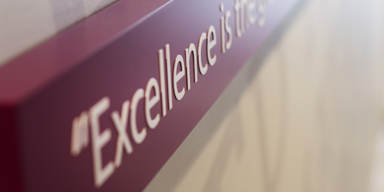 Excellent is wall sign.