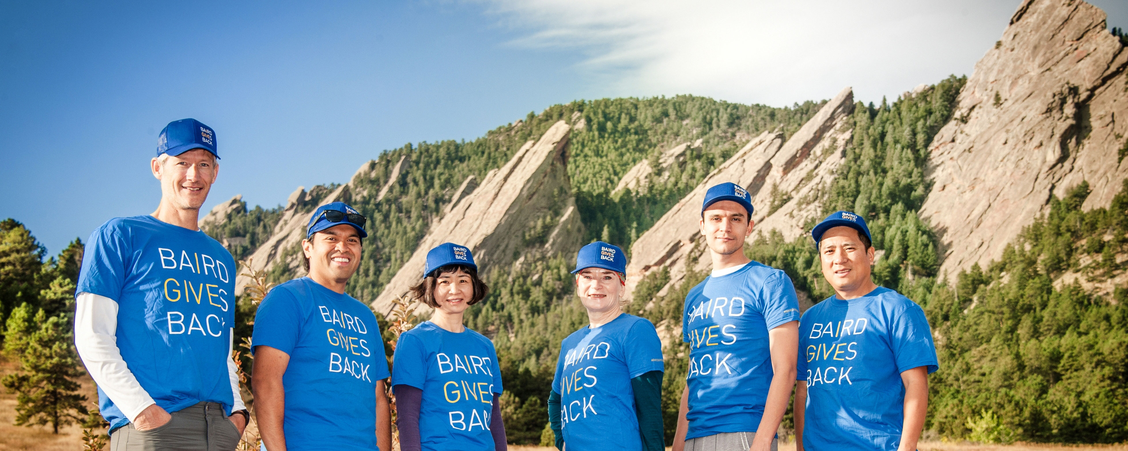 Group of Baird associates in Boulder wearing Baird Gives Back t-shirts.