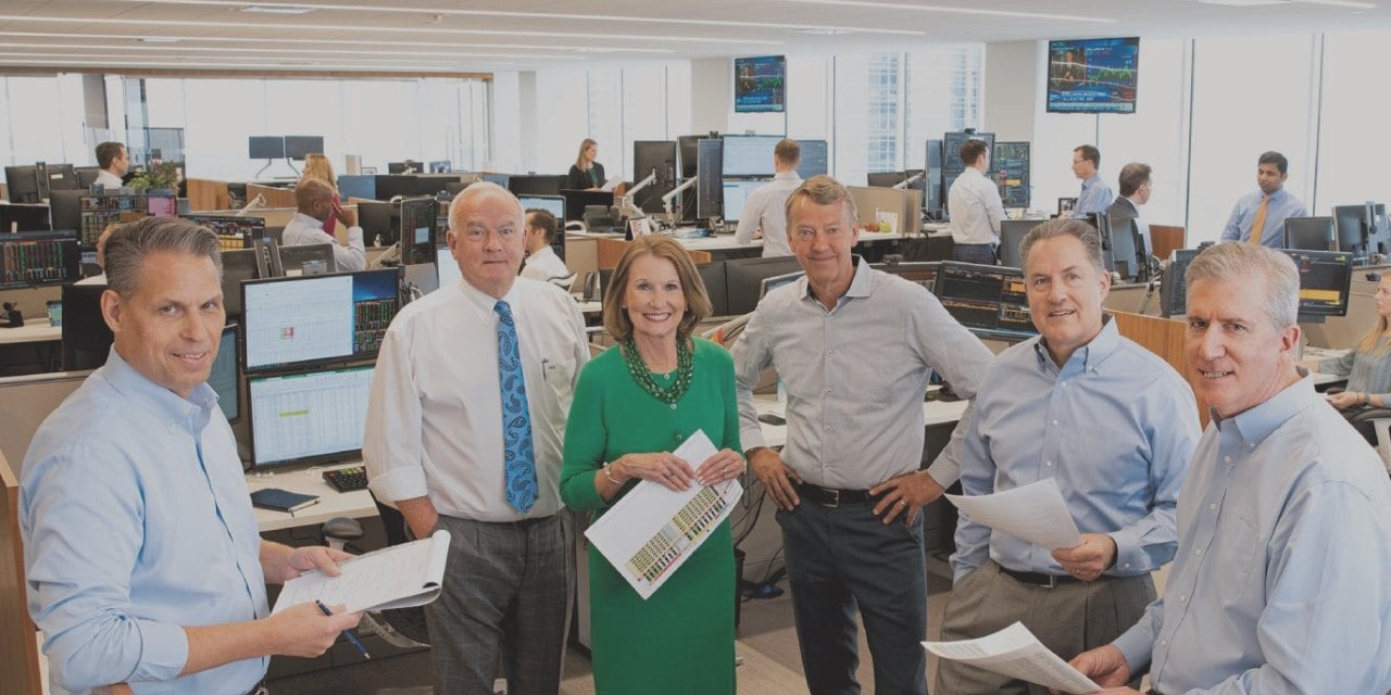 Baird Advisors team standing as a group in office.