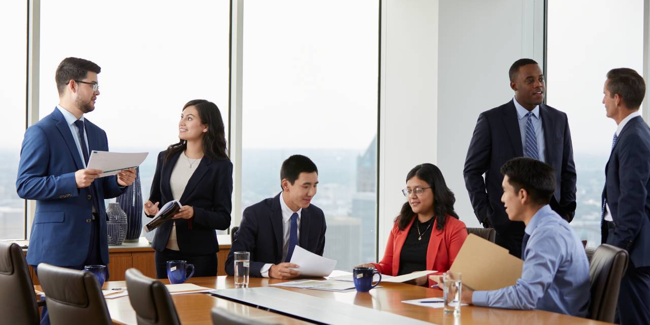 Baird Asset Management interns meeting in a conference room
