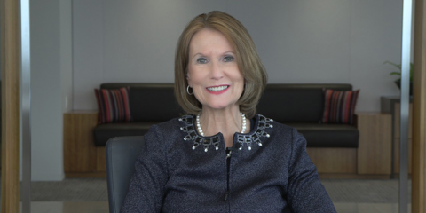 Mary Ellen Stanek sitting in conference room.