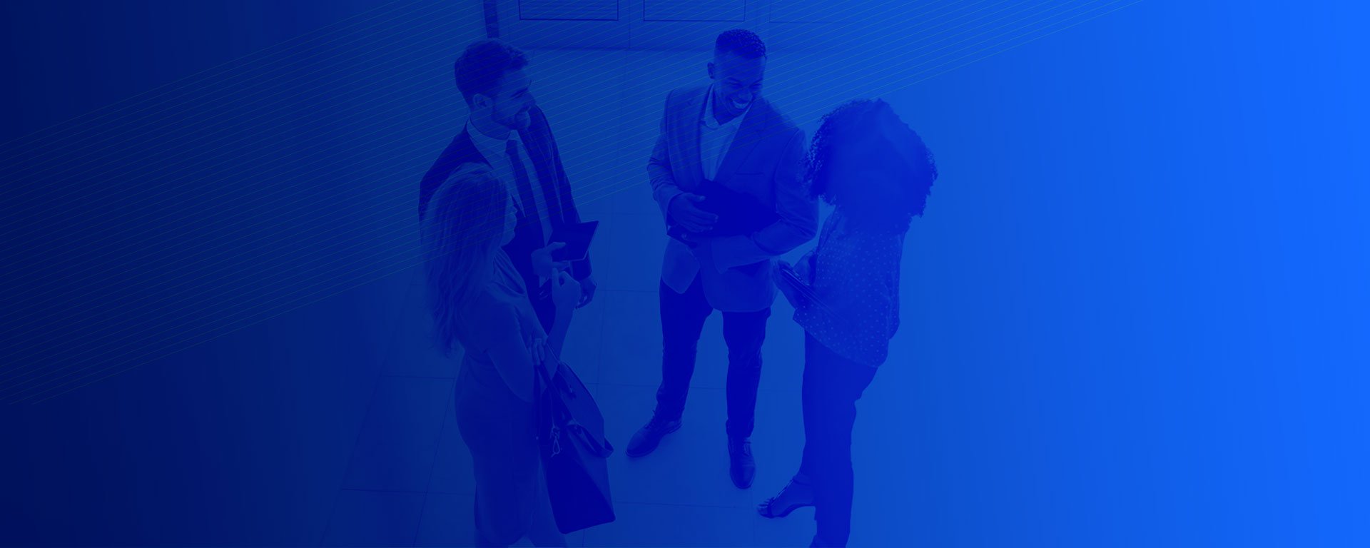 Two men and two women standing in a circle talking.