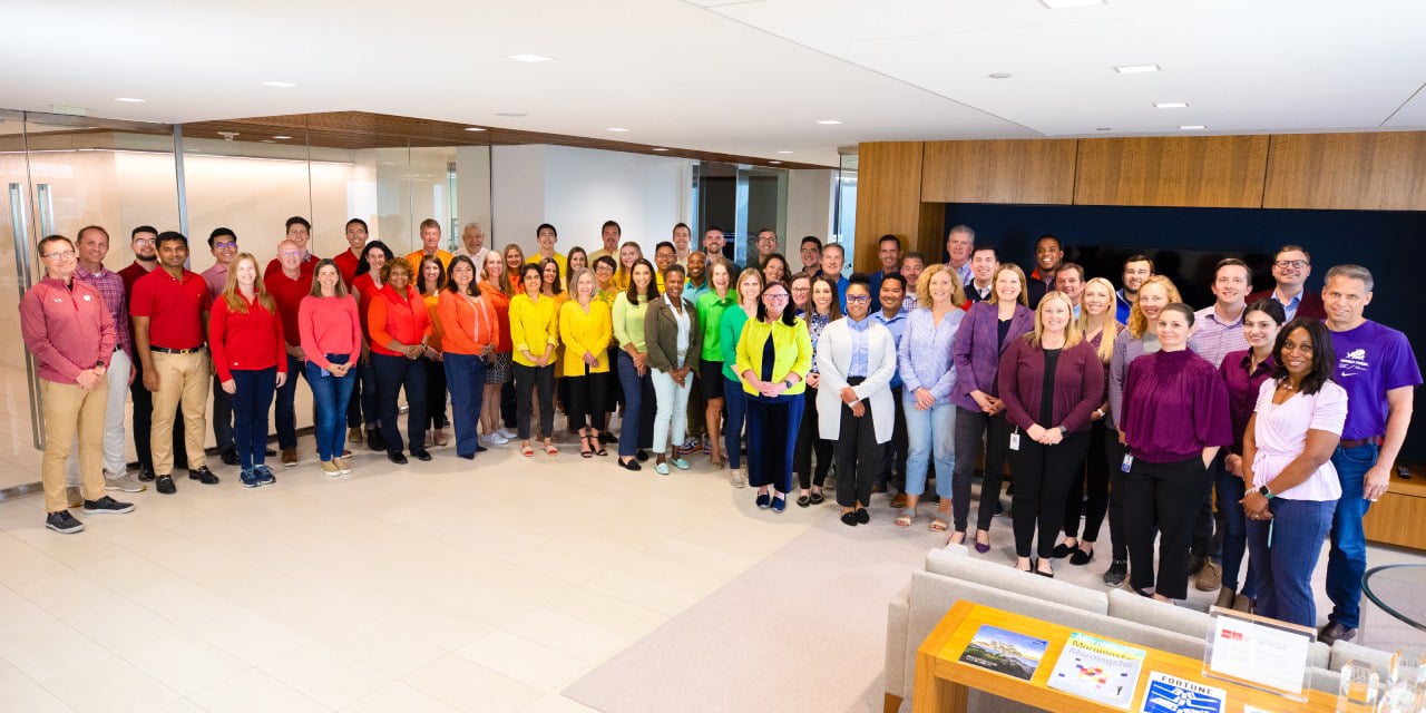 Baird Advisors associates wearing rainbow colored clothing.